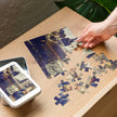 Annunciation by Leonardo da Vinci Puzzle in Tin with glossy finish, showing partial assembly and art on lid, Uffizi Gallery artwork