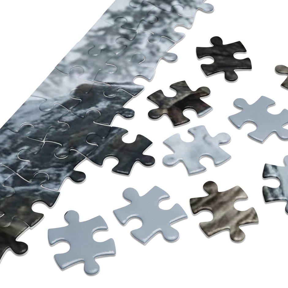 Bull vs Turtle Jigsaw Puzzle in Tin pieces showcasing glossy texture and detailed design.