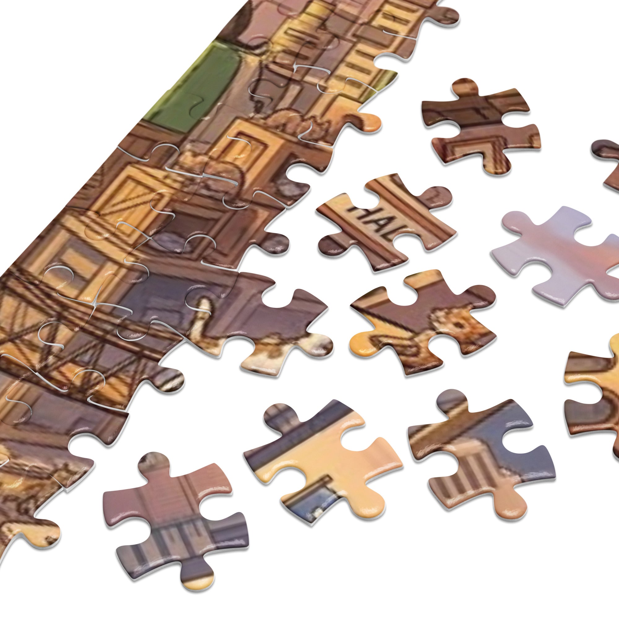 Close-up of the Cat City Life Jigsaw Puzzle in Tin pieces spread out, showcasing detailed urban feline illustrations.