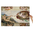 Creatio Adae (The Creation of Adam) Puzzle in Tin featuring Michelangelo's iconic fresco, held by hand, glossy finish.