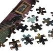 Crow Town Gothic Jigsaw Puzzle in Tin with assembled and loose pieces showcasing dark fantasy art.
