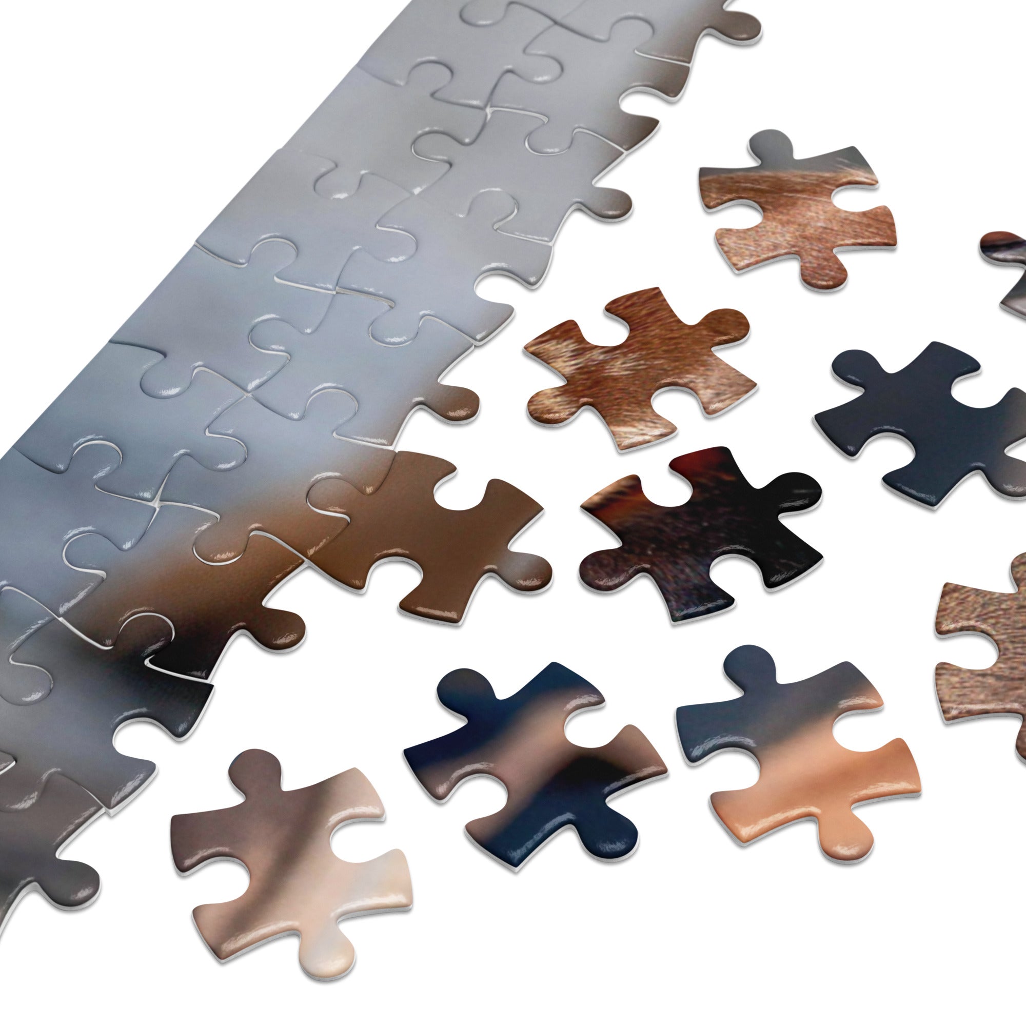 Dachshund Duo Jigsaw Puzzle in Tin pieces scattered, showcasing unique textures and colors of dapple and black-and-tan dachshund coats.