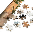 Close-up of German Shepherd Family Loft Jigsaw Puzzle in Tin pieces showing cozy loft details and city skyline.