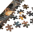 Mouse Market Town Jigsaw Puzzle in Tin pieces close-up showing cozy market square and glowing lantern details.