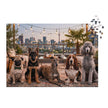 Pug, German Shepherd, Whippet, Basset Hound & Poodle Jigsaw Puzzle in Tin featuring a rooftop scene with dogs at sunset.