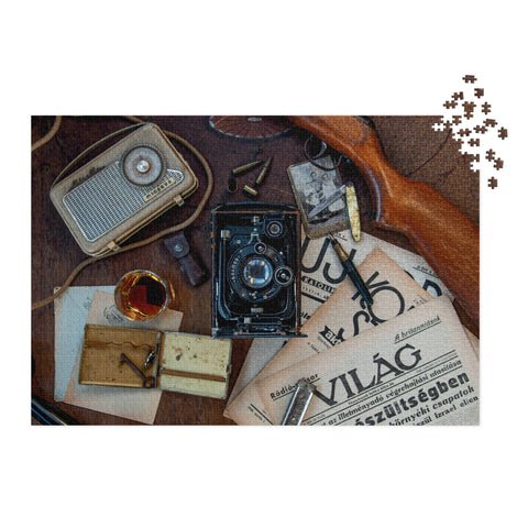 Vintage Explorer Desk Puzzle Tin Edition featuring a vintage camera, classic radio, and scattered documents on a wooden desk.